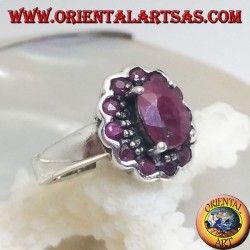 Silver ring with oval natural ruby set surrounded by small round rubies