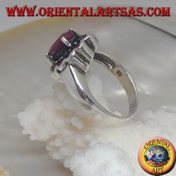 Silver ring with oval natural ruby set surrounded by small round rubies