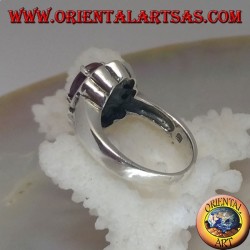 Silver ring with oval natural ruby set surrounded by small round rubies