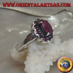 Silver ring with oval natural ruby set surrounded by small round rubies