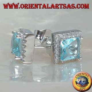Silver earrings with natural blue topaz set in a square surrounded by zircons