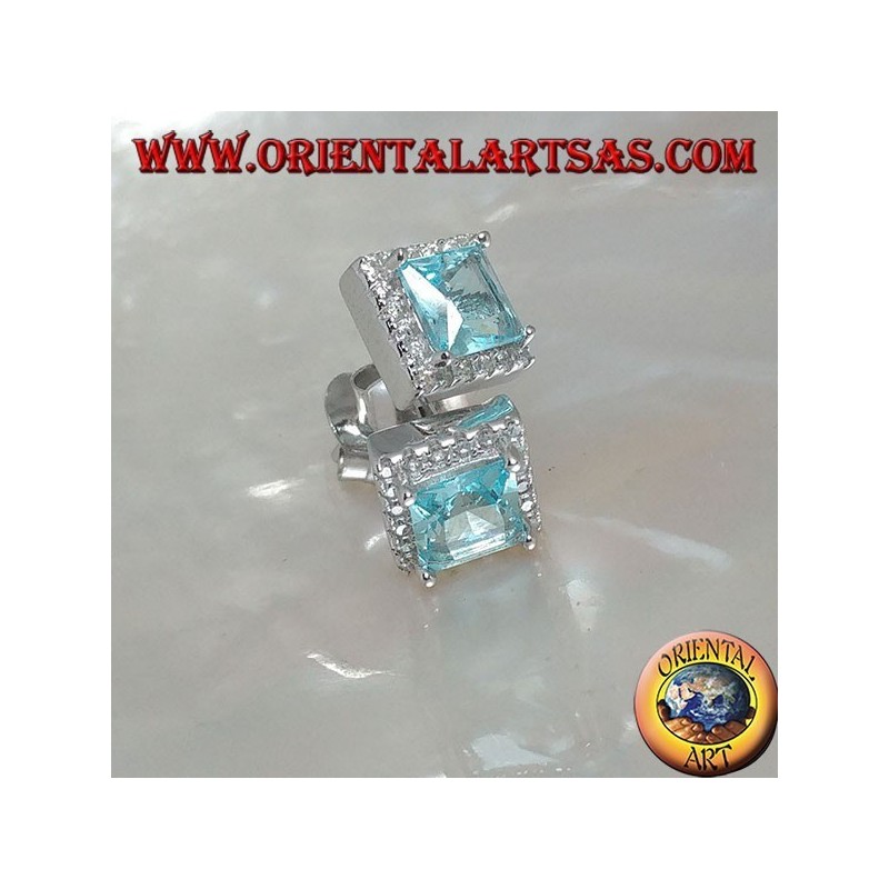 Silver earrings with natural blue topaz set in a square surrounded by zircons