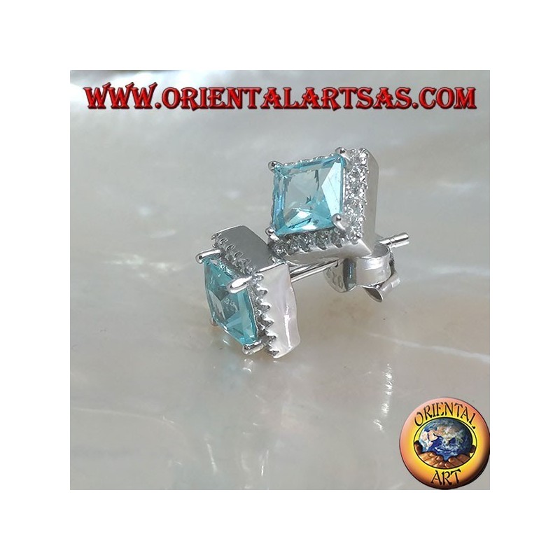 Silver earrings with natural blue topaz set in a square surrounded by zircons