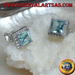 Silver earrings with natural blue topaz set in a square surrounded by zircons