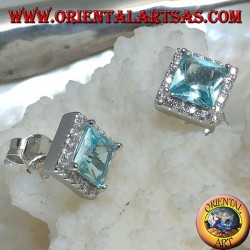 Silver earrings with natural blue topaz set in a square surrounded by zircons