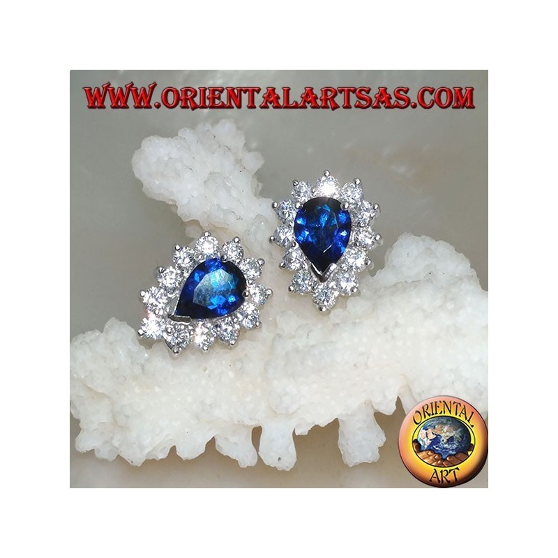 Silver lobe earrings with synthetic teardrop sapphire surrounded by zircons