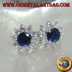 Silver lobe earrings with round synthetic sapphire set surrounded by zircons
