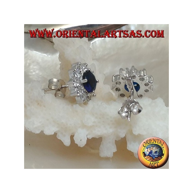 Silver lobe earrings with round synthetic sapphire set surrounded by zircons