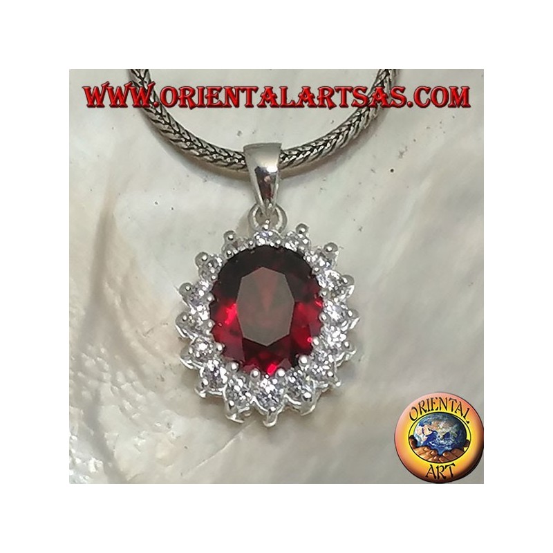 Silver pendant with faceted oval garnet set surrounded by round zircons