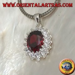 Silver pendant with faceted oval garnet set surrounded by round zircons