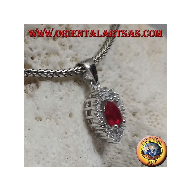 Silver pendant with synthetic teardrop ruby set on an inverted teardrop zircon setting