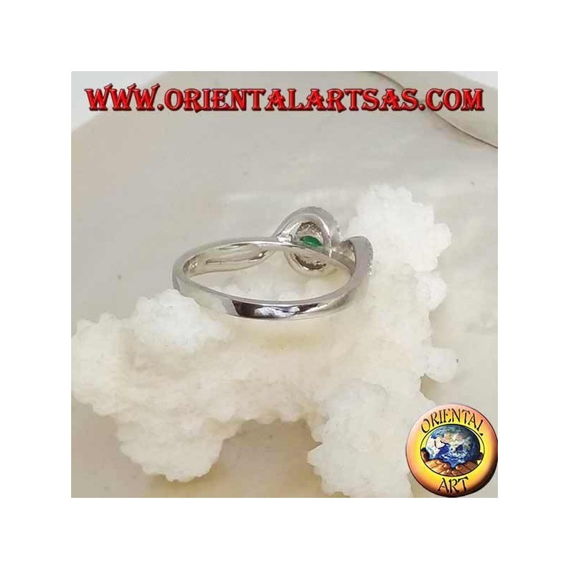 Silver ring with natural round emerald set wrapped in a strip of zircons