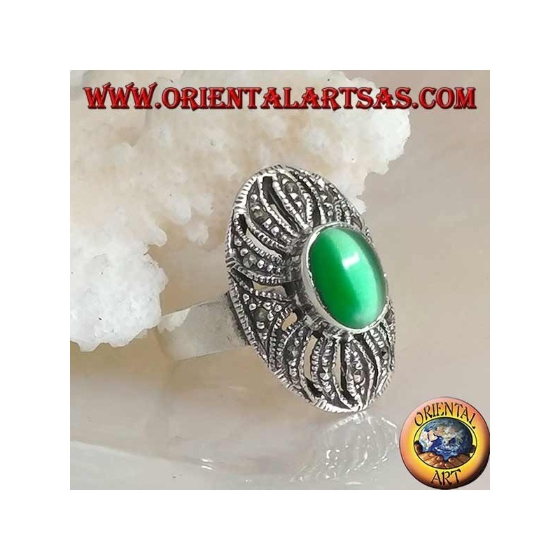 Silver ring with oval green cat's eye on an openwork decoration studded with marcasite