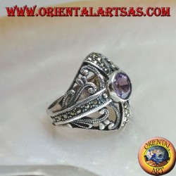 Rounded silver ring with round natural amethyst on a marcasite cross and openwork decorations