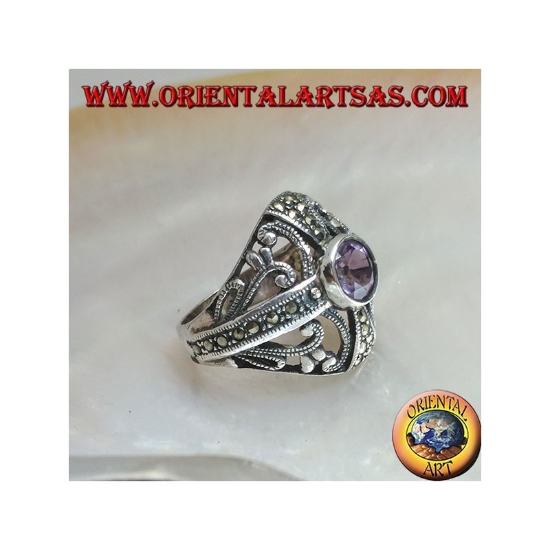Rounded silver ring with round natural amethyst on a marcasite cross and openwork decorations