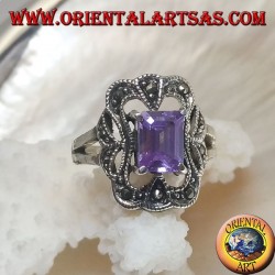 Silver ring with rectangular amethyst colored zircon surrounded by a curved rectangle of marcasite