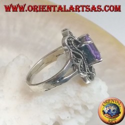 Silver ring with rectangular amethyst colored zircon surrounded by a curved rectangle of marcasite