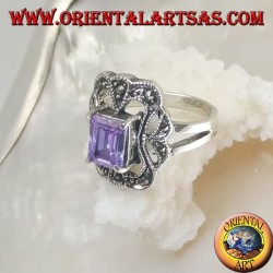 Silver ring with rectangular amethyst colored zircon surrounded by a curved rectangle of marcasite