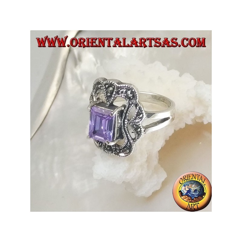 Silver ring with rectangular amethyst colored zircon surrounded by a curved rectangle of marcasite