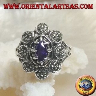 Silver flower ring with central shuttle amethyst-colored zircon and marcasite petals
