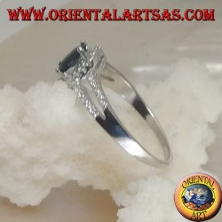 Silver ring with oval synthetic sapphire set surrounded by zircons and two lateral lines