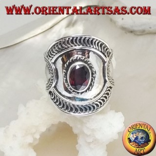 Wide band silver ring with oval garnet and mixed ethnic decorations, Bali
