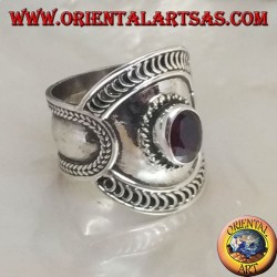 Wide band silver ring with oval garnet and mixed ethnic decorations, Bali