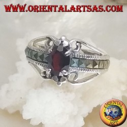 Silver ring set with an oval natural garnet set and a row of square marcasite on the sides