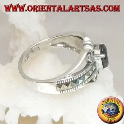 Silver ring set with an oval natural garnet set and a row of square marcasite on the sides