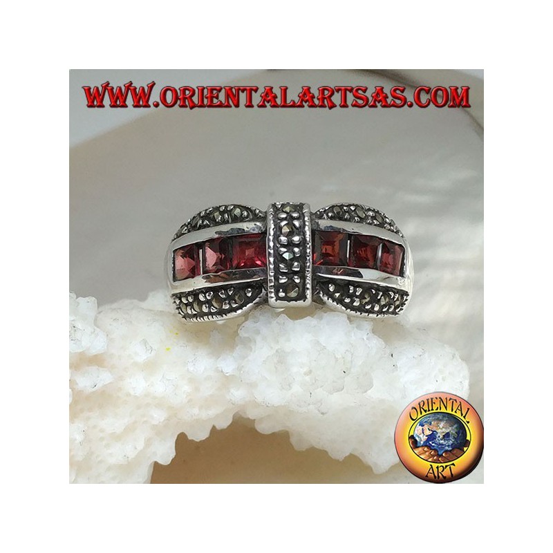 Silver bow tie ring with a row of square garnet and marcasite garnishes