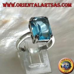 Silver ring with rectangular blue topaz set with a claw setting