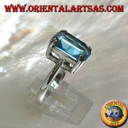 Silver ring with rectangular blue topaz set with a claw setting