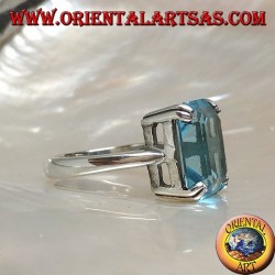 Silver ring with rectangular blue topaz set with a claw setting
