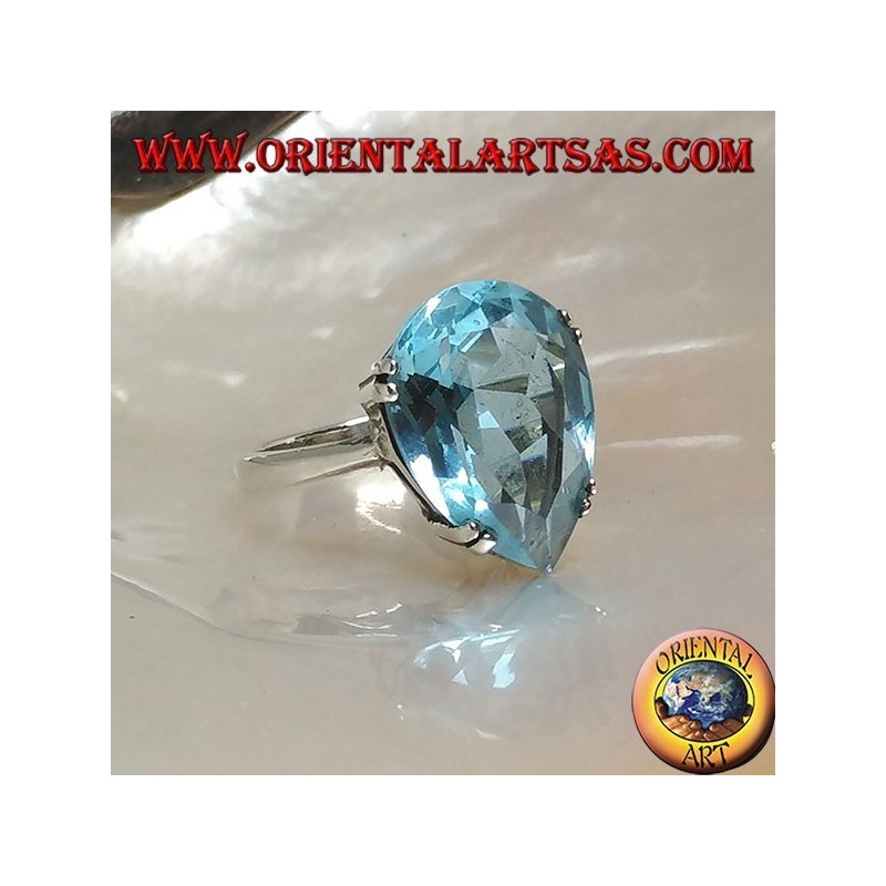 Silver ring with large blue drop topaz set with a claw setting