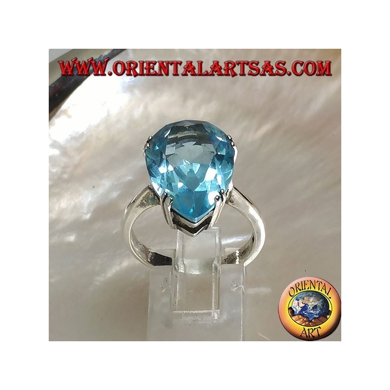 Silver ring with large blue drop topaz set with a claw setting