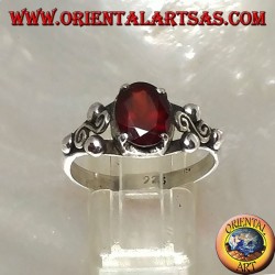 Silver ring with oval faceted garnet and Greek garnet between three balls on the sides