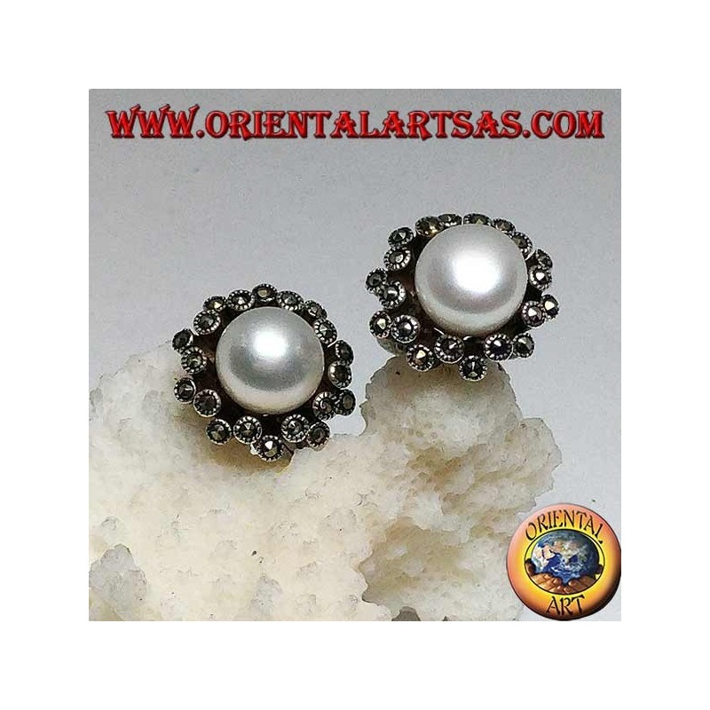 Lever-lock silver earrings with freshwater pearl surrounded by two alternating lines of marcasite