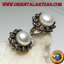 Lever-lock silver earrings with freshwater pearl surrounded by two alternating lines of marcasite