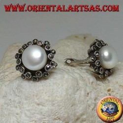 Lever-lock silver earrings with freshwater pearl surrounded by two alternating lines of marcasite