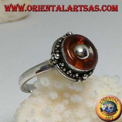 Bague en argent avec disque d'ambre naturel et boule centrale