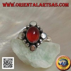 Silver ring with oval cabochon carnelian surrounded by alternating studs and balls