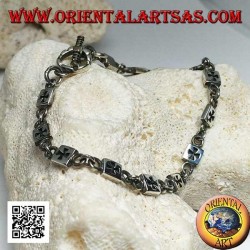 Soft silver bracelet with plaques engraved with bas-relief alternating with rings