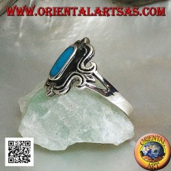 Silver ring with oval turquoise elongated in a stylized rectangle