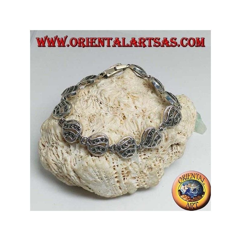 Bracciale in argento con 11 cuori traforati con due linee ondulate tempestati di marcassite
