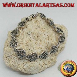 Silver bracelet with 11 openwork hearts with two wavy lines studded with marcasite