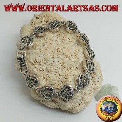 Silver bracelet with 11 openwork hearts with two wavy lines studded with marcasite