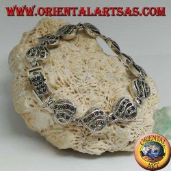 Silver bracelet with 11 openwork hearts with two wavy lines studded with marcasite