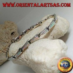 Silver bracelet with 13 isosceles trapezoids elongated in harlequin opal