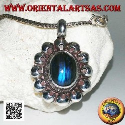 Silver pendant with oval blue fluorescent labradorite cabochon surrounded by perforated discs
