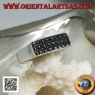 Silver ring with raised rectangular plate with large and small dots